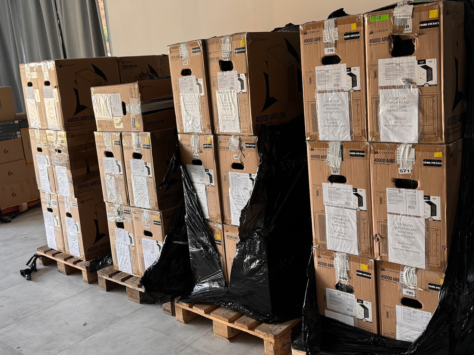 Before: PCs on pallets in factory packaging